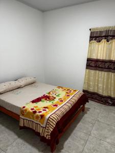 En eller flere senge i et værelse på Departamento - Casa - Quinta Temporaria