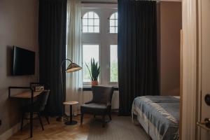TV a/nebo společenská místnost v ubytování Home Hotel Christian IV