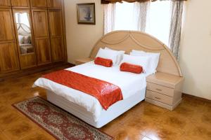 Postel nebo postele na pokoji v ubytování Unique Comfort Guest House