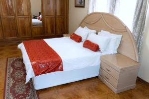 Postel nebo postele na pokoji v ubytování Unique Comfort Guest House