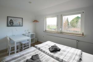 Postel nebo postele na pokoji v ubytování Ferienwohnung am Glück