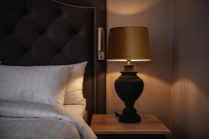 Postel nebo postele na pokoji v ubytování Home Hotel Christian IV