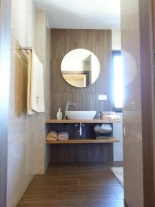 a bathroom with a sink and a mirror at Agroturystyka Nad Lasem - Domki w górach in Toporzysko +67 photos