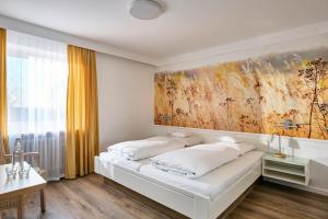 Postel nebo postele na pokoji v ubytování Hotel Mayer