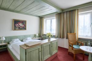 Postel nebo postele na pokoji v ubytování Hotel Mayer