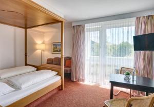Postel nebo postele na pokoji v ubytování Hotel Mayer