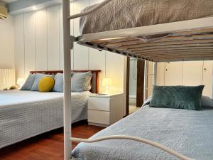 Ένα ή περισσότερα κρεβάτια σε δωμάτιο στο Holihome - Le Magnolie +26 φωτογραφίες