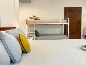 Ένα ή περισσότερα κρεβάτια σε δωμάτιο στο Holihome - Le Magnolie