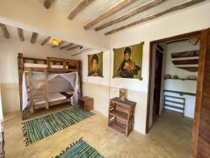a room with two bunk beds and a doorway at Breeze Residence in Kiwengwa +112 photos