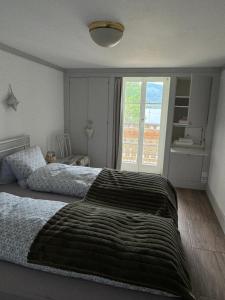 A bed or beds in a room at Double Room with view