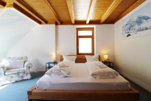 a bedroom with a bed in a room with a window at Apartment "Blackforest", Todtnau, 5 Schlafzimmer in Todtnau +17 photos