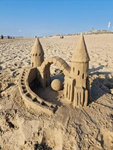 a sand castle on the beach on the beach at ZeeBedStay in Noordwijk aan Zee