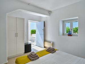 Voodi või voodid majutusasutuse ARIADNI Lux villa with 180 panoramic sea view toas