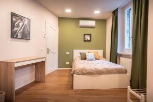 Postel nebo postele na pokoji v ubytování B&B San Gabriele
