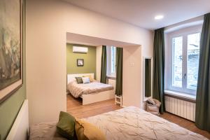 Postel nebo postele na pokoji v ubytování B&B San Gabriele