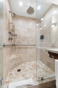 a bathroom with a shower with a glass door at The Lodge at Jackson Hole in Jackson