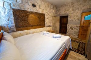 A bed or beds in a room at hotels crazy horse