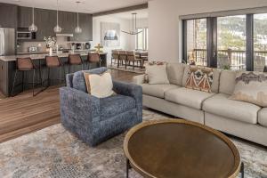 a living room with a couch and a table at Beaverhead Condo - 5 Slalom #301 in Big Sky
