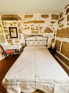 Ένα ή περισσότερα κρεβάτια σε δωμάτιο στο Casa Camino e Mar