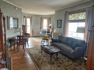 a living room with a couch and a table at LimeRock Inn in Rockland
