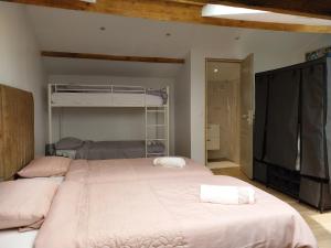 a bedroom with a large bed with two towels on it at ZE Luxurious House Paris - Suite de luxe in Argenteuil