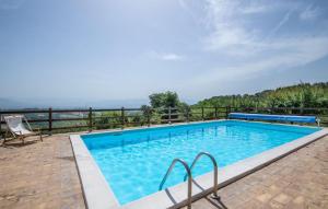 a swimming pool with a chair next to a fence at Casa Alloro, Ac, Wifi, Narni in Narni