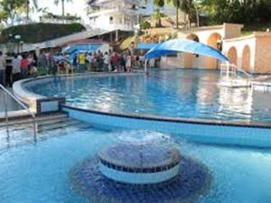 Πισίνα στο ή κοντά στο Aconchegante apto 104 fica 5 min do Parque Termal +29 φωτογραφίες