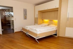 a bedroom with a large bed in a room at Lord Nelson 115 in Döse +29 photos