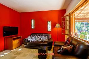 Μια τηλεόραση ή/και κέντρο ψυχαγωγίας στο Casa em Teresópolis com Piscina e Churrasqueira