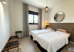 Postel nebo postele na pokoji v ubytování 007 Apartamento con vistas al mar