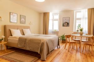 Posteľ alebo postele v izbe v ubytovaní Cocorico Apartments