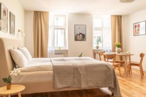 Posteľ alebo postele v izbe v ubytovaní Cocorico Apartments