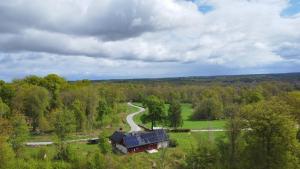 an aerial view of a house in the middle of a forest at Villa Lisbeth in Osby