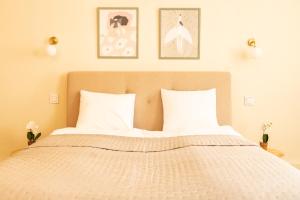 Posteľ alebo postele v izbe v ubytovaní Cocorico Apartments