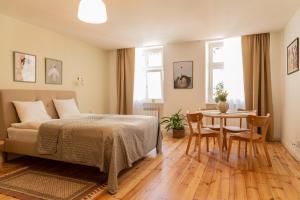 Posteľ alebo postele v izbe v ubytovaní Cocorico Apartments
