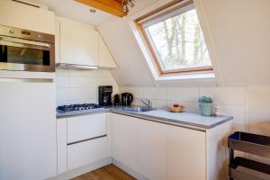 Η κουζίνα ή μικρή κουζίνα στο Groenling I Heerlijk Huis met Privacy Tuin en Uitzicht Landerij +24 φωτογραφίες