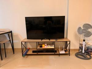 a flat screen tv sitting on top of a table at The Spot in Marilao