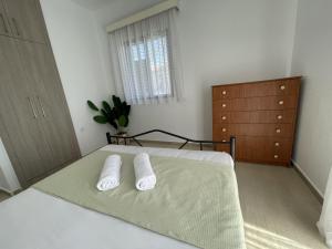 Postel nebo postele na pokoji v ubytování Elfeko Cottage