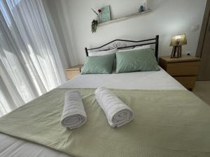 Postel nebo postele na pokoji v ubytování Elfeko Cottage