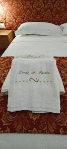 Letto o letti in una camera di Leoni di Sicilia