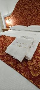 Letto o letti in una camera di Leoni di Sicilia