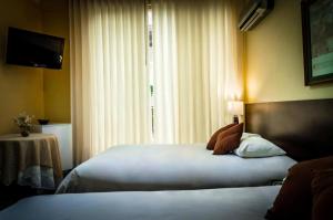 Postel nebo postele na pokoji v ubytování Gran Bolivar Hotel - Trujillo, Perú