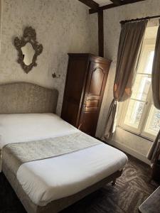 Postel nebo postele na pokoji v ubytování Hotel Montsegur