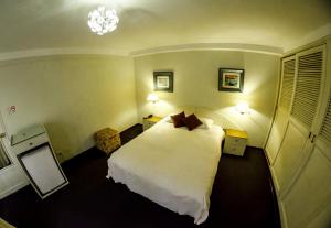 Postel nebo postele na pokoji v ubytování Gran Bolivar Hotel - Trujillo, Perú