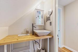 a bathroom with a sink on a wooden counter at Willow Cove in York +33 photos