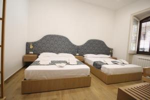 Letto o letti in una camera di Leoni di Sicilia