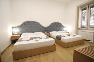 Letto o letti in una camera di Leoni di Sicilia
