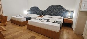 Letto o letti in una camera di Leoni di Sicilia
