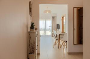 a living room with a table and a dining room at Varandas do Mar, Olhos de Agua, 1 Bed Apt AT23 in Olhos de Água