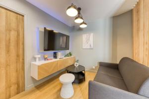 TV a/nebo společenská místnost v ubytování Duplex appartement Paris